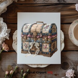 May include: A vintage wooden chest with a blue and white floral design. The chest has a brass lock and hinges, and is decorated with a pink ribbon and lace.