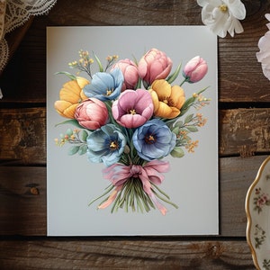 May include: A bouquet of pastel coloured tulips tied with a pink ribbon. The bouquet includes yellow, pink, and blue tulips.