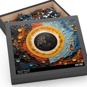 Puede incluir: Un rompecabezas de 500 piezas con un diseño abstracto colorido que presenta un gran círculo negro rodeado de anillos concéntricos de amarillo, naranja, rojo y azul. La caja del rompecabezas está abierta, revelando las piezas del rompecabezas en el interior. La caja tiene el texto "16x20 Puzzle 500 pcs Ages 9+"