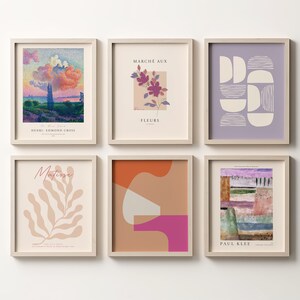 May include: Six framed art prints featuring a variety of styles and colours. The prints include abstract shapes, landscapes, and floral designs. All prints are in white frames and arranged in a grid pattern.