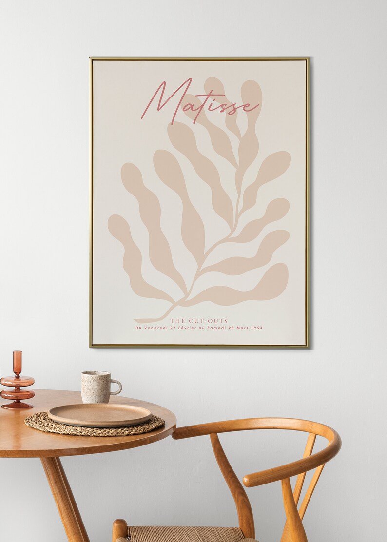May include: A beige and pink abstract art print with the text "Matisse" and "THE CUT-OUTS Du Vendredi 27 Fevrier au Samedi 28 Mars 1952" in a gold frame.