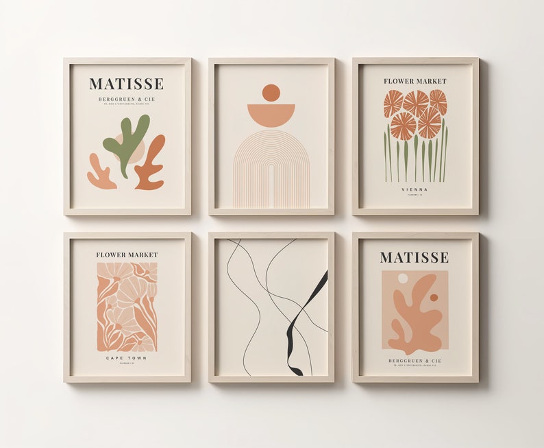 May include: Six minimalist art prints in beige frames with abstract designs in shades of brown, green, and black. The prints feature text such as "Matisse" and "Flower Market".