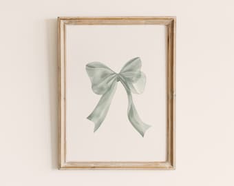 May include: A framed print of a watercolor painting of a sage green bow.