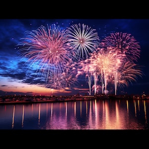 May include: A night sky filled with colorful fireworks exploding over a body of water. The fireworks are pink, purple, and white, and they are reflected in the water.