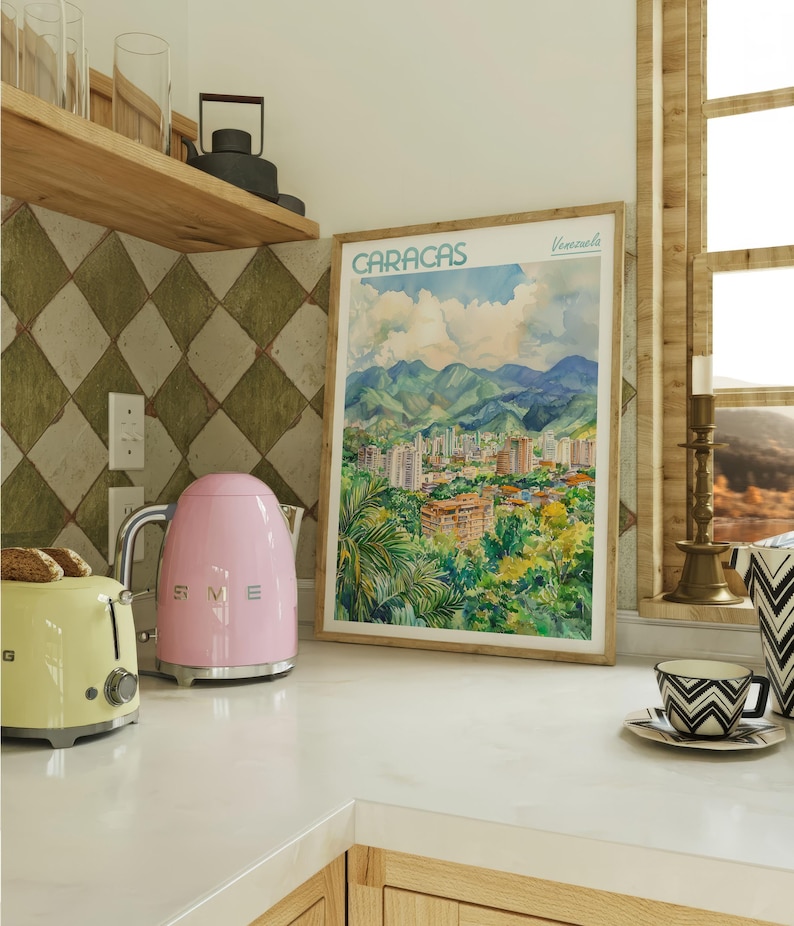a kitchen counter with a pink toaster and a picture of a city