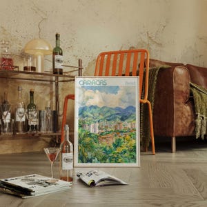 a magazine sitting on a table next to a bottle of wine