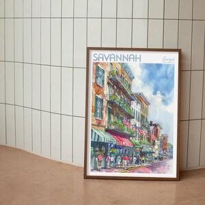 May include: A watercolor painting of a street scene in Savannah, Georgia. The painting depicts a row of colorful buildings with balconies and awnings. There are people walking on the street and American flags hanging from the buildings.