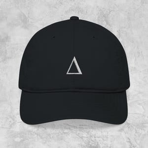 May include: Black baseball cap with a white embroidered triangle logo on the front. The cap has a curved brim and a structured fit. The hat is made of a durable fabric and is suitable for everyday wear.