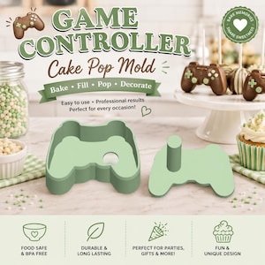 May include: A light green game controller cake pop mold consisting of two pieces: a hollow frame shaped like a video game controller and a matching flat press tool with a cylindrical handle. The mold is designed for shaping cake pops.