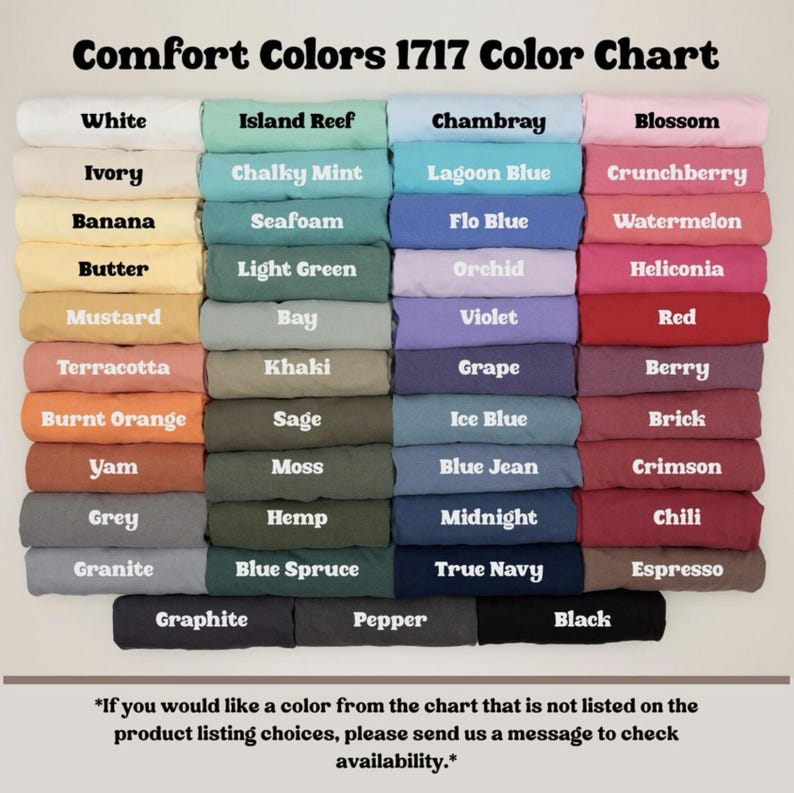 May include: A color chart titled "Comfort Colors 1717 Color Chart" displays a variety of fabric colors. The chart includes shades like white, ivory, banana, mustard, terracotta, burnt orange, yam, grey, and granite. Other colors include island reef, chambray, blossom, and black.