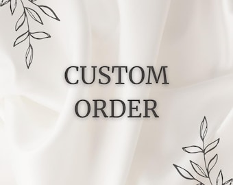 May include: White fabric background with the text "CUSTOM ORDER" in black lettering.  The background is folded and has a simple floral design in the corners.