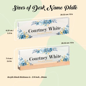 May include: Two desk name plates with floral designs and the name "Courtney White, Executive Director." The top plate is 8 inches long and 2.5 inches tall. The bottom plate is 8 inches long and 2.6 inches tall, with a wooden base. Acrylic block thickness is 3/4 inch.