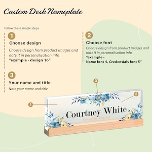 May include: A custom desk nameplate with a clear acrylic front and a wooden base. The nameplate features a floral design in shades of blue and yellow. The name "Courtney White" and title "Executive Director" are displayed in elegant fonts.