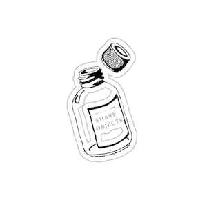 May include: A black and white sticker illustration of a glass bottle with an open cap floating above it. The bottle features a rectangular label with the text SHARP OBJECTS printed in clear, capitalized black lettering on the front surface.