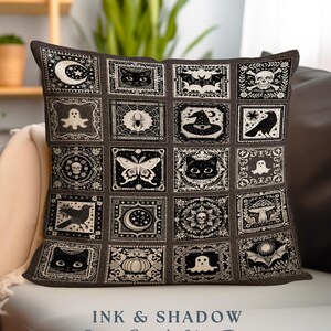 May include: A black and white woven pillow with a patchwork design featuring various Halloween-themed illustrations, including cats, bats, ghosts, spiders, pumpkins, and moons. The pillow has the text "INK & SHADOW Original Fine Art Woven Pillow" printed on the bottom.