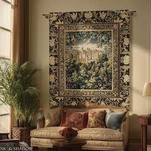 May include: A rectangular wall tapestry featuring a central landscape scene of a castle nestled in a forest, surrounded by a wide black border with a repeating floral pattern in cream and green. The tapestry hangs from a metal rod.