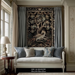 May include: A white daybed with five decorative pillows sits beneath a large black tapestry featuring a detailed dragon and tree motif. The tapestry is framed by light blue curtains. The text INK & SHADOW Fine Art Home Decor is visible.