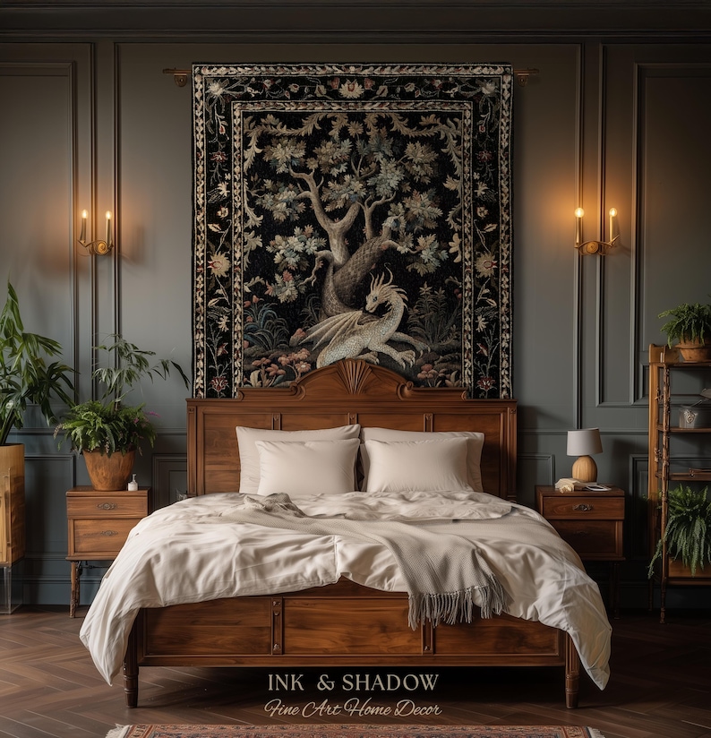 May include: A rectangular wall tapestry featuring a detailed illustration of a dragon resting beneath a large tree against a black background, framed by a floral border. The text INK & SHADOW Fine Art Home Decor is printed at the bottom.