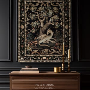 May include: A rectangular wall tapestry featuring a central illustration of a light-colored dragon resting beneath a large tree, surrounded by floral motifs and a decorative border on a black background, with the text INK & SHADOW Fine Art Home Decor.