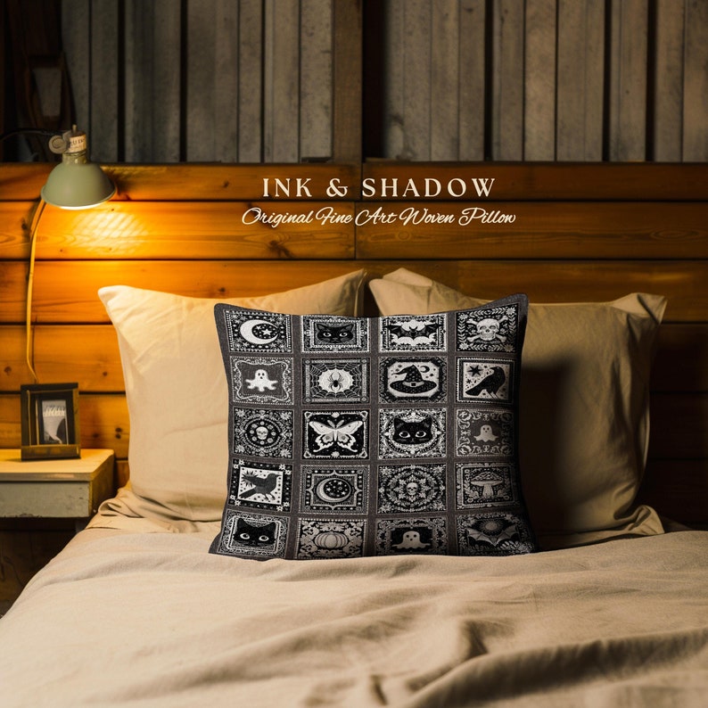 May include: A black and white woven pillow with a Halloween theme. The pillow features a variety of spooky designs, including bats, ghosts, cats, spiders, and pumpkins. The pillow is on a bed with a brown headboard and a beige bedspread. The text "INK & SHADOW Original Fine Art Woven Pillow" is displayed above the pillow.