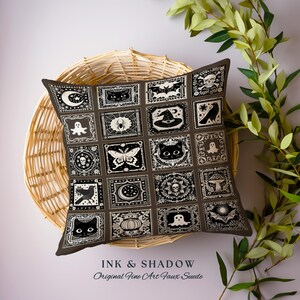 May include: A brown throw pillow with a black and white pattern of various Halloween-themed images, including bats, ghosts, spiders, and pumpkins. The pillow is made of faux suede and has the text "INK & SHADOW Original Fine Art Faux Suede" printed on the bottom.