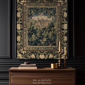 May include: A rectangular wall tapestry featuring a detailed woven scene of a castle nestled within a dense forest. The tapestry is framed by a wide, dark border decorated with intricate floral patterns in shades of gold, green, and black.