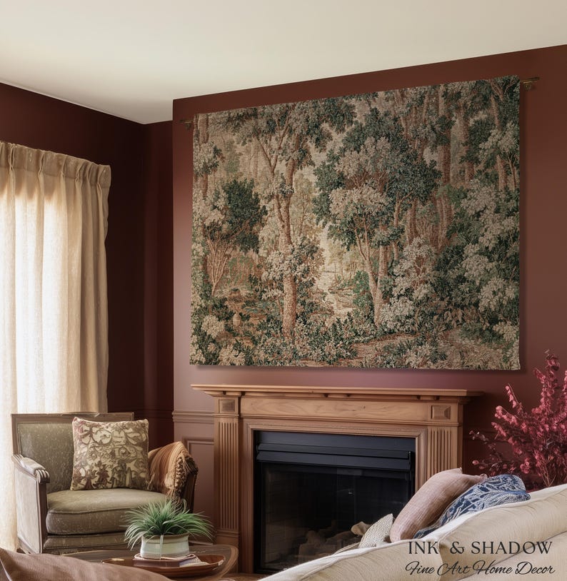 May include: A large tapestry depicting a forest scene with trees and foliage in shades of green, brown, and cream. The tapestry is mounted above a fireplace in a room with burgundy walls. The text "INK & SHADOW Fine Art Home Decor" is visible.