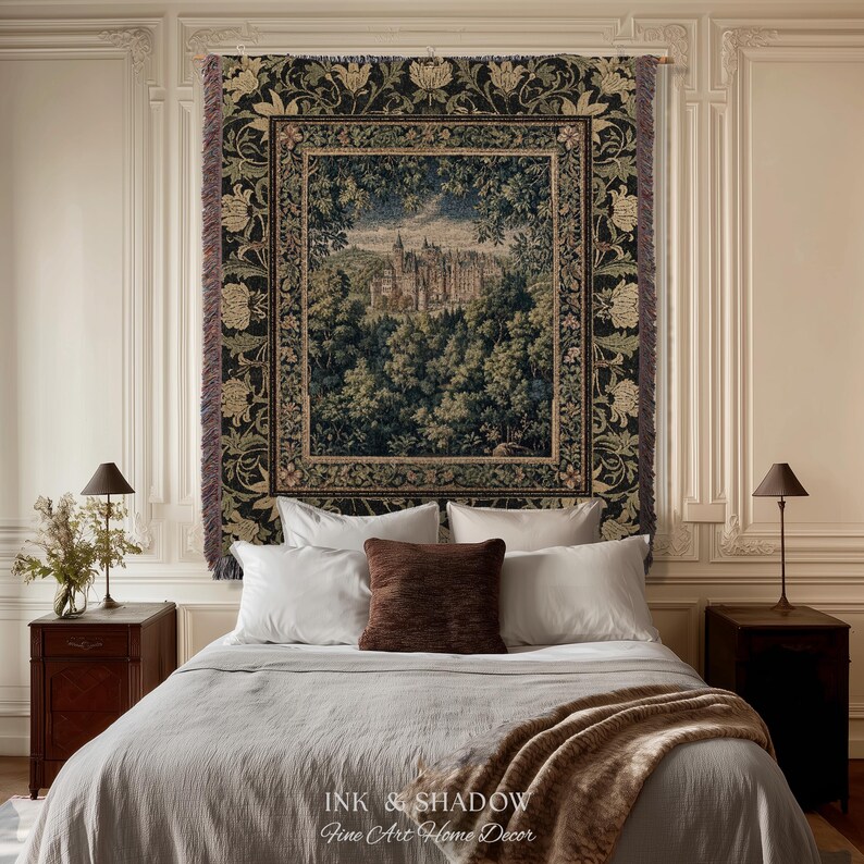 May include: A rectangular woven wall tapestry featuring a detailed landscape scene of a castle nestled within a dense forest. The tapestry has a dark border with floral motifs and fringed edges, displaying shades of green, brown, and cream.