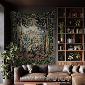 May include: A woven wall tapestry featuring a detailed landscape scene of a castle nestled within a dense forest. The artwork is framed by a dark green border with floral patterns and includes the text Ink & Shadow Fine Art Home Decor.