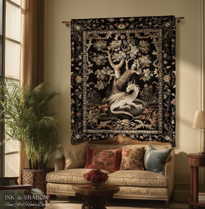 May include: A rectangular wall tapestry featuring a white dragon resting beneath a large tree against a black background, surrounded by a detailed floral border. The artwork is mounted on a horizontal rod and displays the text Ink & Shadow.