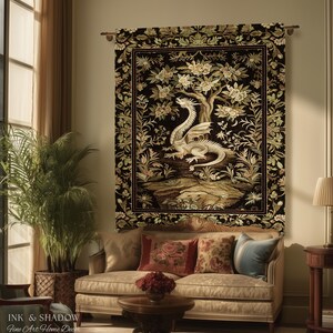 May include: A rectangular wall tapestry featuring a central white dragon illustration set against a black background with a detailed floral border. The artwork depicts a dragon perched on a rocky landscape beneath a flowering tree, framed by intricate botanical motifs.