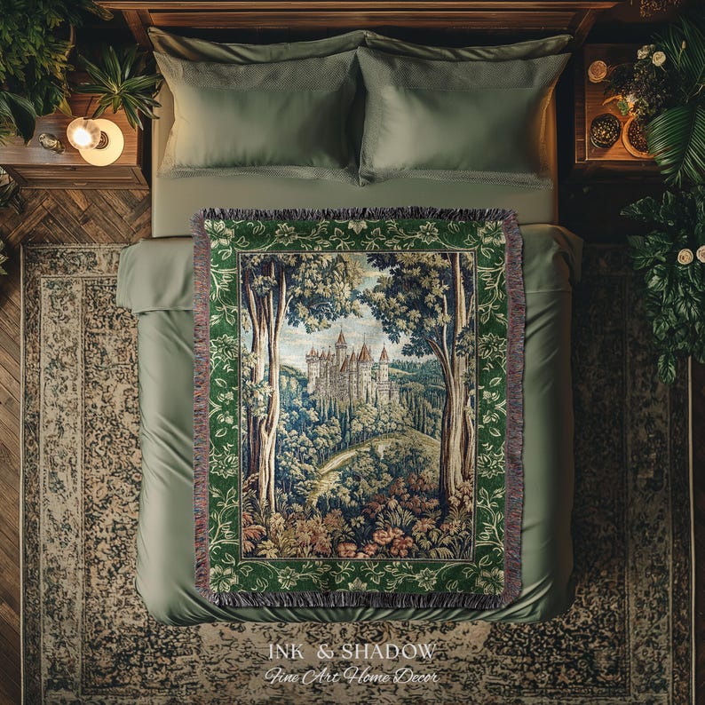 May include: A woven throw blanket featuring a detailed tapestry-style scene of a castle nestled within a dense forest. The blanket has a dark green border with floral patterns and fringed edges, displaying a landscape with trees and a castle.