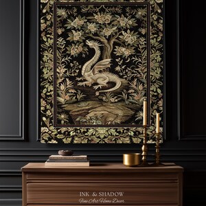 May include: A rectangular wall tapestry featuring a central cream-colored dragon perched on a rocky outcrop beneath a flowering tree, surrounded by a detailed floral border in shades of green, gold, and black, with the text Ink & Shadow Fine Art Home Decor.