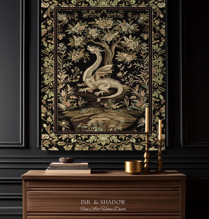 May include: A rectangular wall tapestry featuring a central cream-colored dragon perched on a rocky outcrop beneath a flowering tree, surrounded by a detailed floral border in shades of green, gold, and black, with the text Ink & Shadow Fine Art Home Decor.