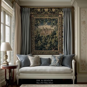 May include: A white daybed with a collection of grey and patterned throw pillows positioned beneath a large rectangular wall tapestry featuring a detailed landscape of a castle surrounded by a dense forest, with the text INK & SHADOW Fine Art Home Decor.