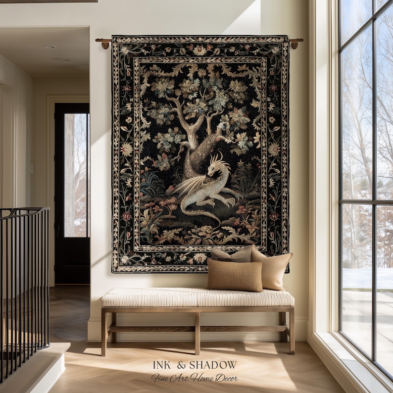 May include: A rectangular wall tapestry featuring a central illustration of a light-colored dragon resting beneath a large tree, surrounded by floral motifs on a black background, framed by a decorative border, hanging from a metal rod.