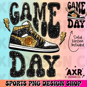 May include: Black and gold glitter graphic design with the text "GAME DAY" and a basketball shoe. The design includes a smaller version of the graphic with the text "GAME DAY" in a solid black colour.