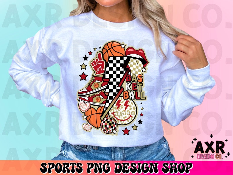 K&ouml;nnte beinhalten: Wei&szlig;es Sweatshirt mit einem Basketball-Motiv. Das Design umfasst einen Basketball, Turnschuhe, Lippen und einen Blitz. Der Text "BASKETBALL" ist ebenfalls vorhanden. Die Worte "SPORTS PNG DESIGN SHOP" stehen unten.