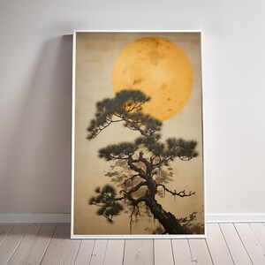May include: A framed print of a Japanese-style painting depicting a dark green pine tree with a large, yellow moon in the background.