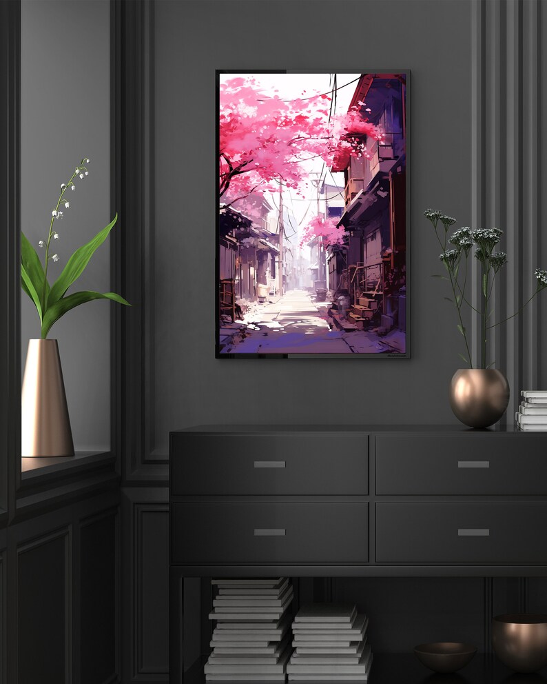 May include: A digital painting depicting a narrow street in a Japanese city. The street is lined with traditional buildings and cherry blossom trees. The trees are in full bloom, and the pink blossoms are falling to the ground. The street is empty, and the sun is shining brightly.