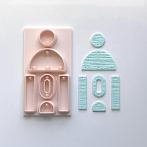 Allt-i-ett örhängesstans och hålslag i polymerlera | E-87