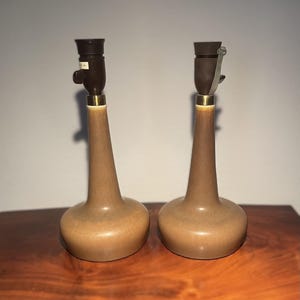 1 pair of beautiful Le Klint table lamps model 310B, manufactured by Palshus, Denmark 1960s