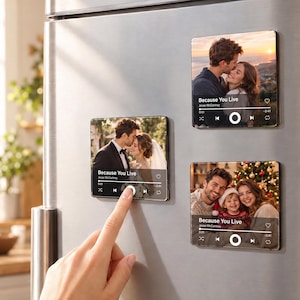 May include: Three square refrigerator magnets featuring custom photo prints designed to look like music player interfaces. Each magnet displays the song title Because You Live by Jesse McCartney with playback controls and a progress bar.