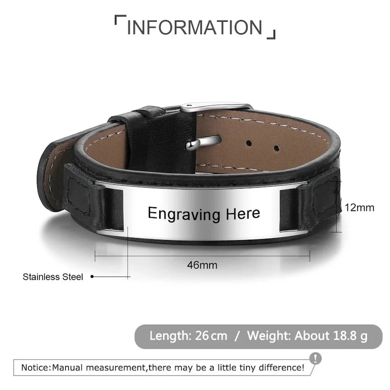 May include: A black leather bracelet with a stainless steel buckle and a silver rectangular plate that says "Engraving Here". The bracelet is 26 cm long and weighs 18.8 grams.
