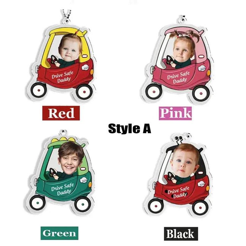 May include: Four different colored car-shaped acrylic ornaments with a photo frame in the front. The ornaments are red, pink, green, and black. Each ornament has the text "Drive Safe Daddy" printed on the front.