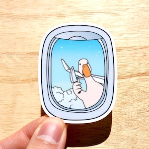 Dumme Gans mit Messer Aufkleber Stabby Gans im Flugzeug Fenster lustig Geschenk Meme Aufkleber Vinyl Planer Notebook Laptop und Kindle Aufkleber.