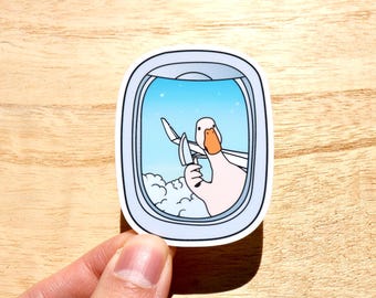 Sticker Silly Goose With Knife, Stabby Goose at plane window, Cadeau de voyage amusant, meme, carnet de notes en vinyle pour ordinateur portable et stickers Kindle.