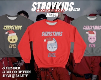 May include: Three gray sweatshirts with a Christmas theme featuring a cartoon character wearing a Santa hat. The text on the sweatshirts reads "Christmas Evel".