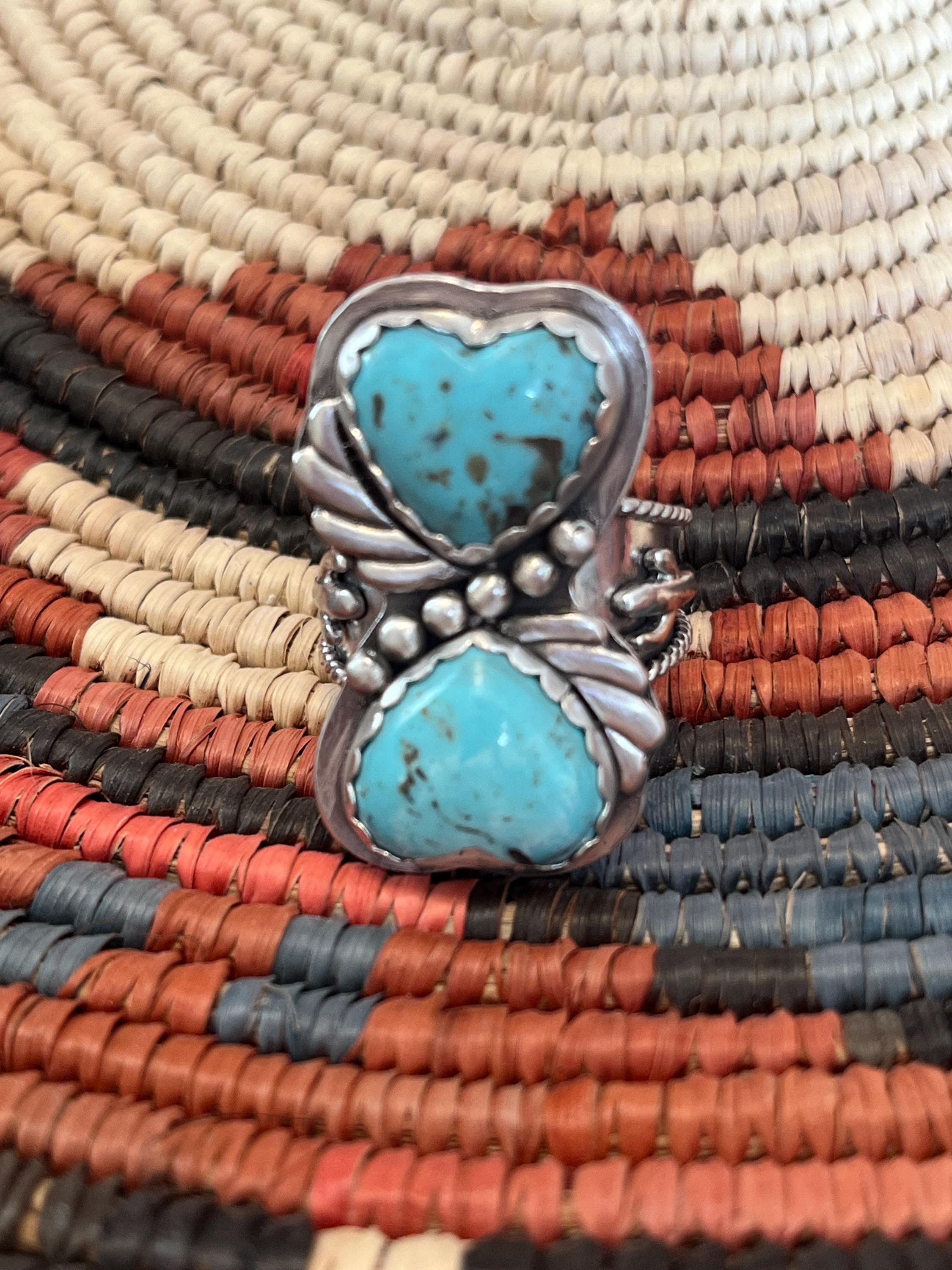 Gorgeous baby blue Kingman turquoise heart shaped cabochons set in sterling silver. Tapered sterling ring band with cactus detail. Size 10.5