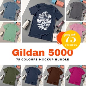 May include: A mockup bundle of Gildan 5000 t-shirts in various colors. One navy blue t-shirt displays the text "It always seems impossible until it's done." The image also includes a graphic with "75 COLOURS".